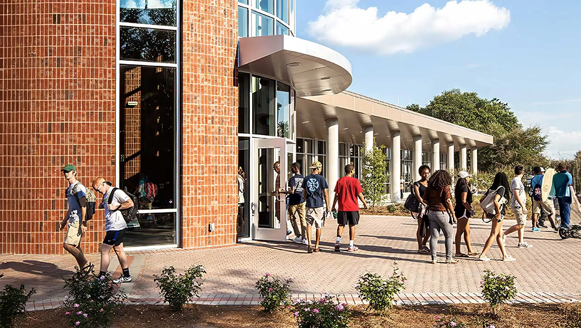 Students walking in and out of building